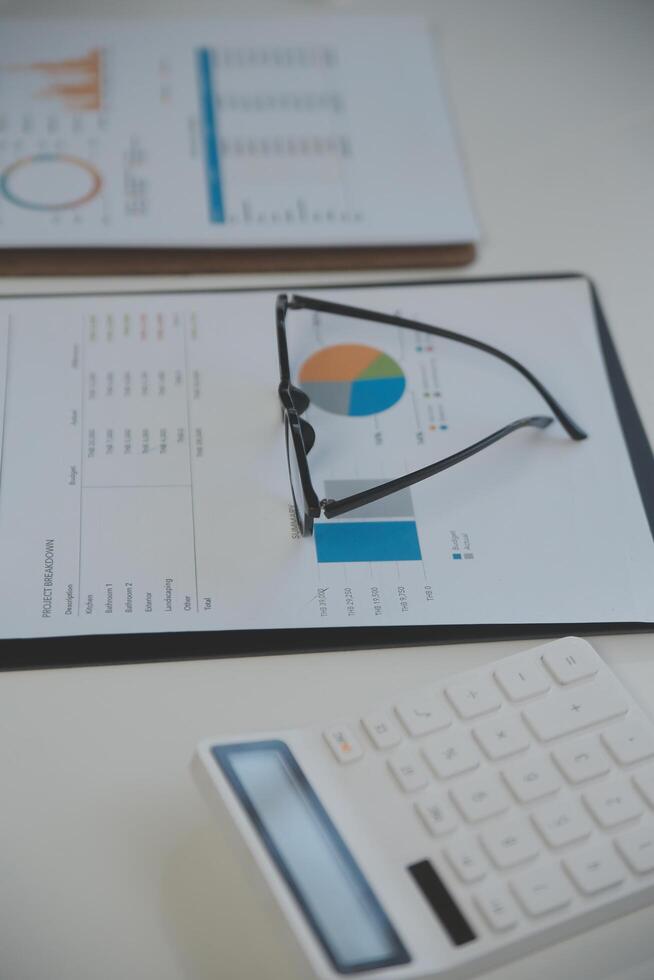 Laptop computer with opened lid on table in meeting room of office workspace. photo
