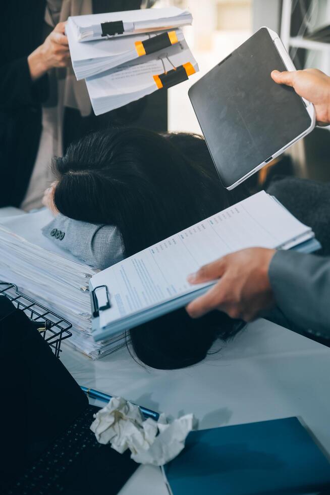 Stressful business man have so many paperwork in the office photo