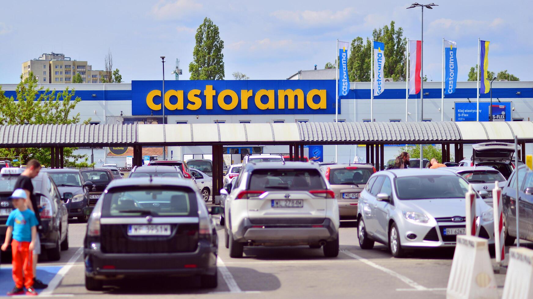 Warsaw, Poland. 28 April 2024. Signboard with brand logo of Castorama home improvement retailer and building supplies store. photo