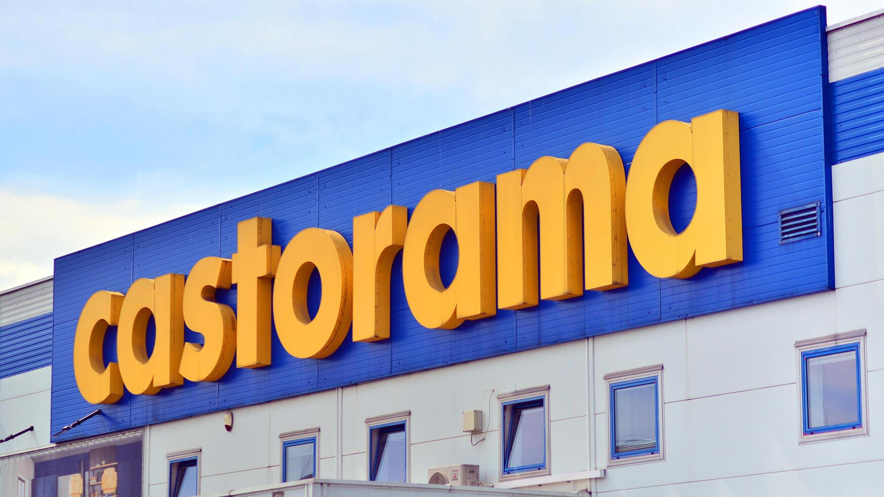 Warsaw, Poland. 28 April 2024. Signboard with brand logo of Castorama home improvement retailer and building supplies store. photo