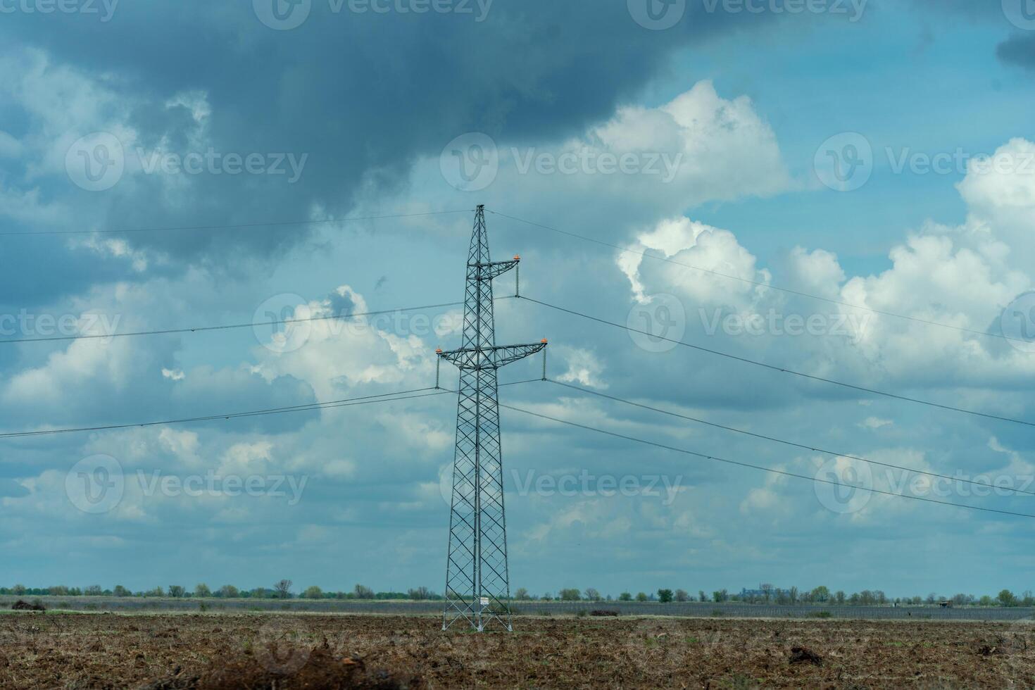 High voltage towers with sky background. Power line support with wires for electricity transmission. High voltage grid tower with wire cable at distribution station. Energy industry, energy saving photo