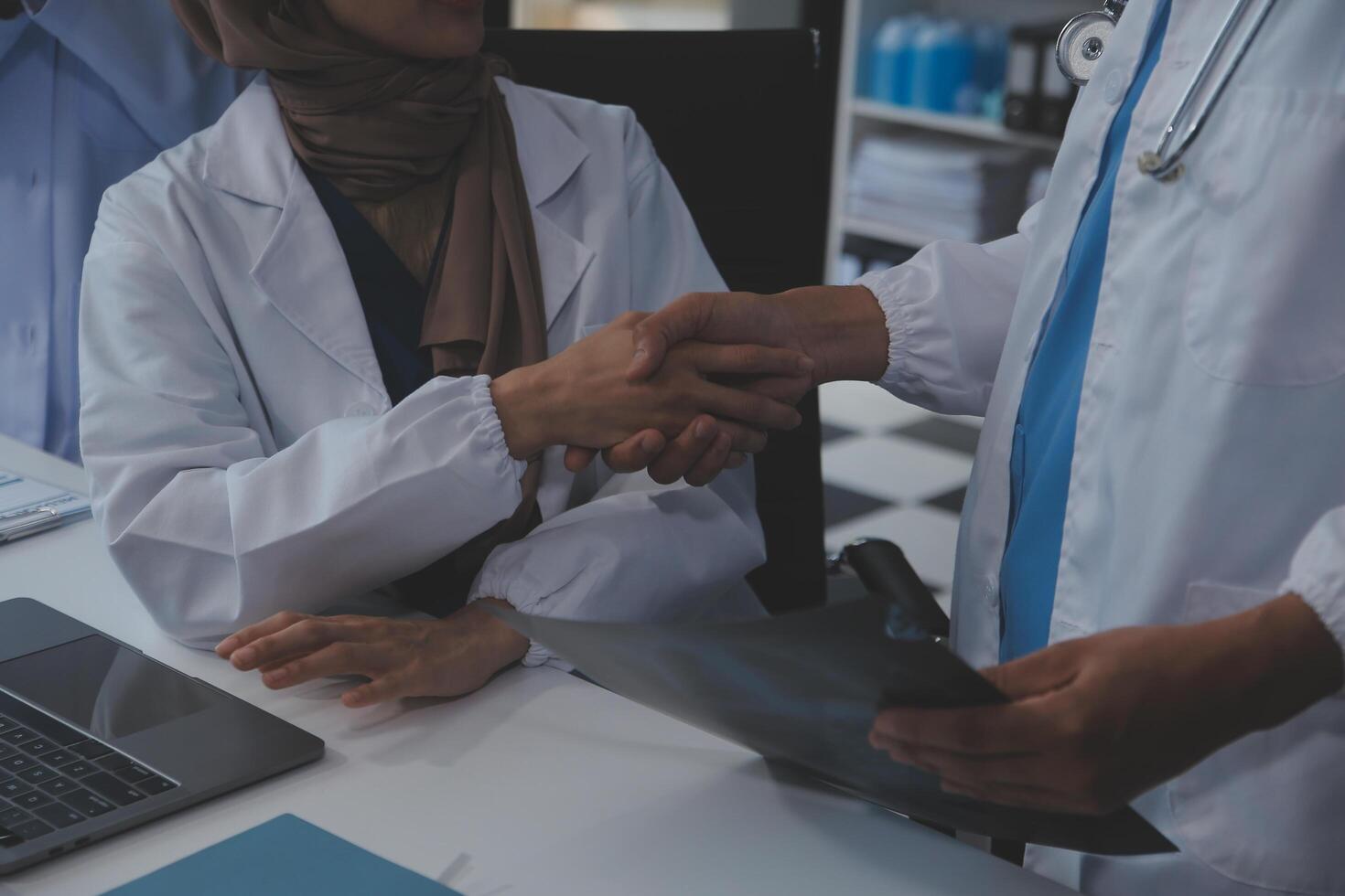 The medical team joins hands and works togetherGroup of scientists joining hands to create experimental works that meet their goals or the success of the trials that have been completed photo