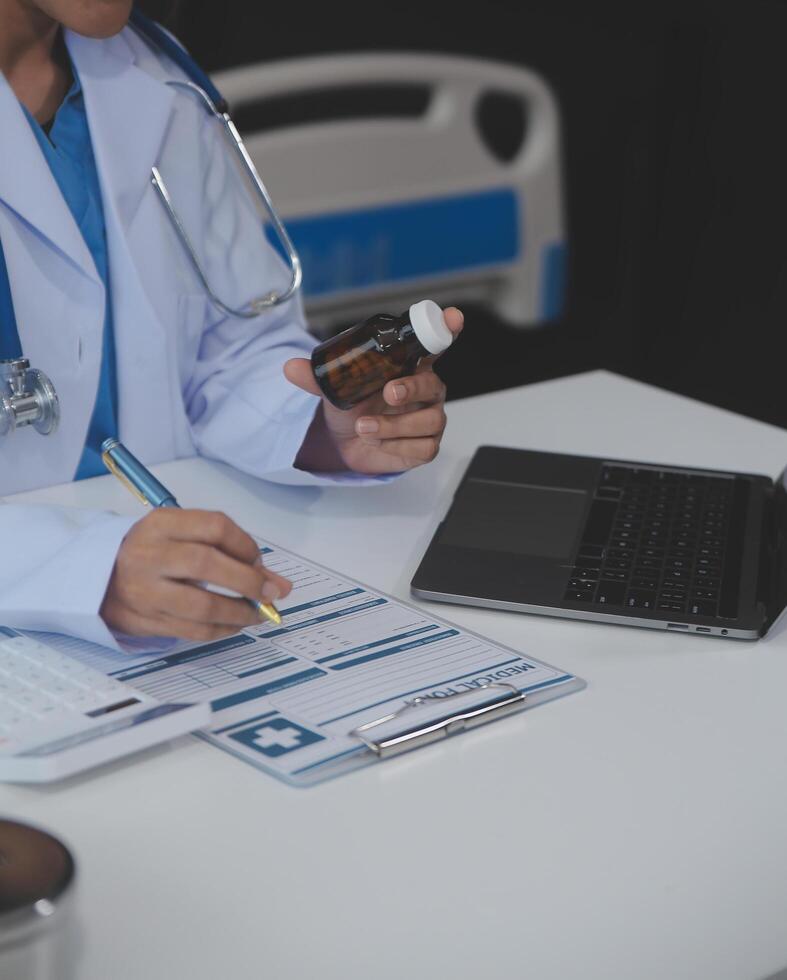 Cropped view of doctor in white coat holding bottle medication, prescribing pills to sick patient via online consultation. Family therapist recommend quality medicines. Healthcare, treatment concept photo