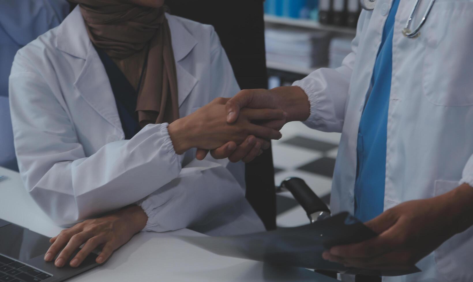 The medical team joins hands and works togetherGroup of scientists joining hands to create experimental works that meet their goals or the success of the trials that have been completed photo