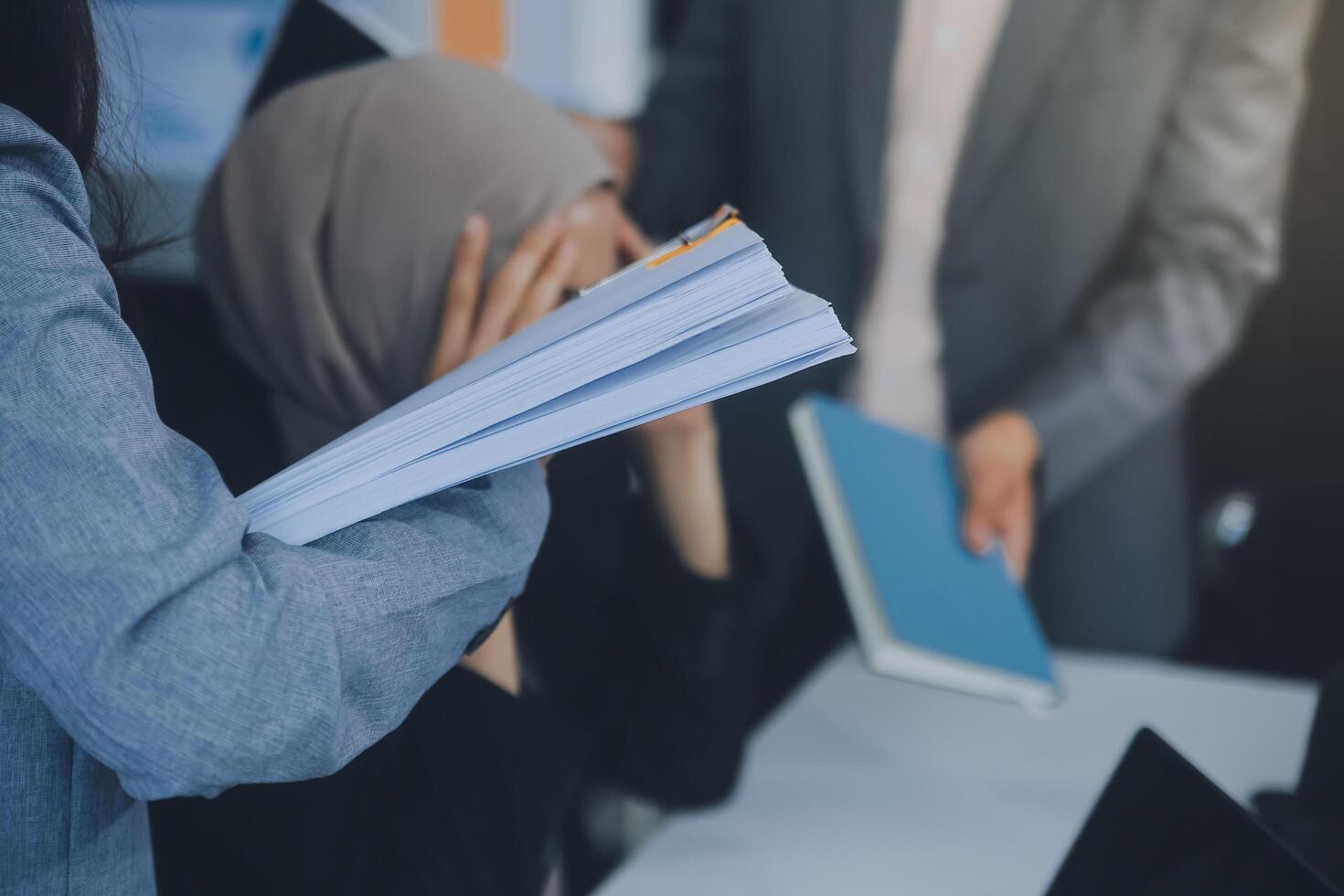 Stressful business man have so many paperwork in the office photo