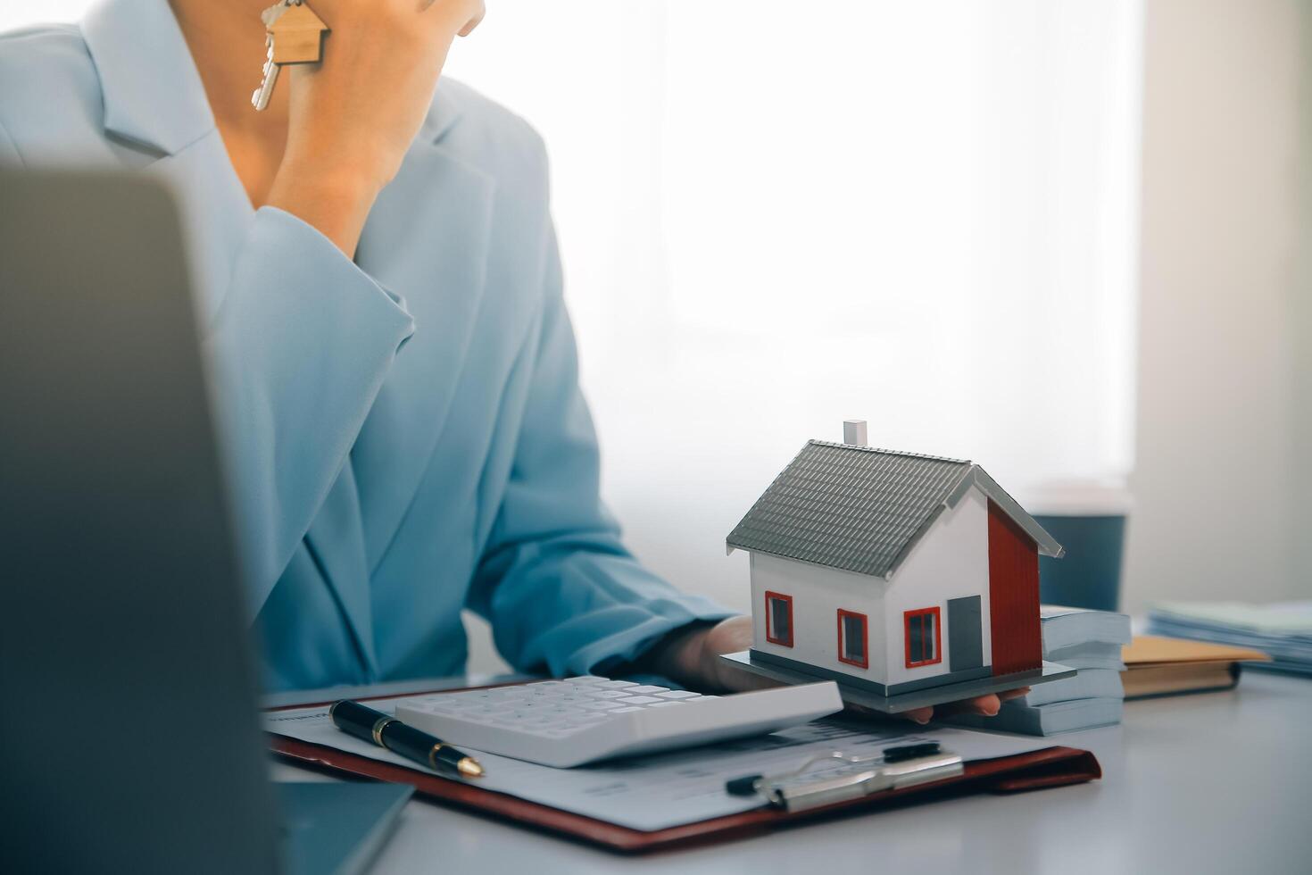 Real estate agent talked about the terms of the home purchase agreement and asked the customer to sign the documents to make the contract legally, Home sales and home insurance concept. photo