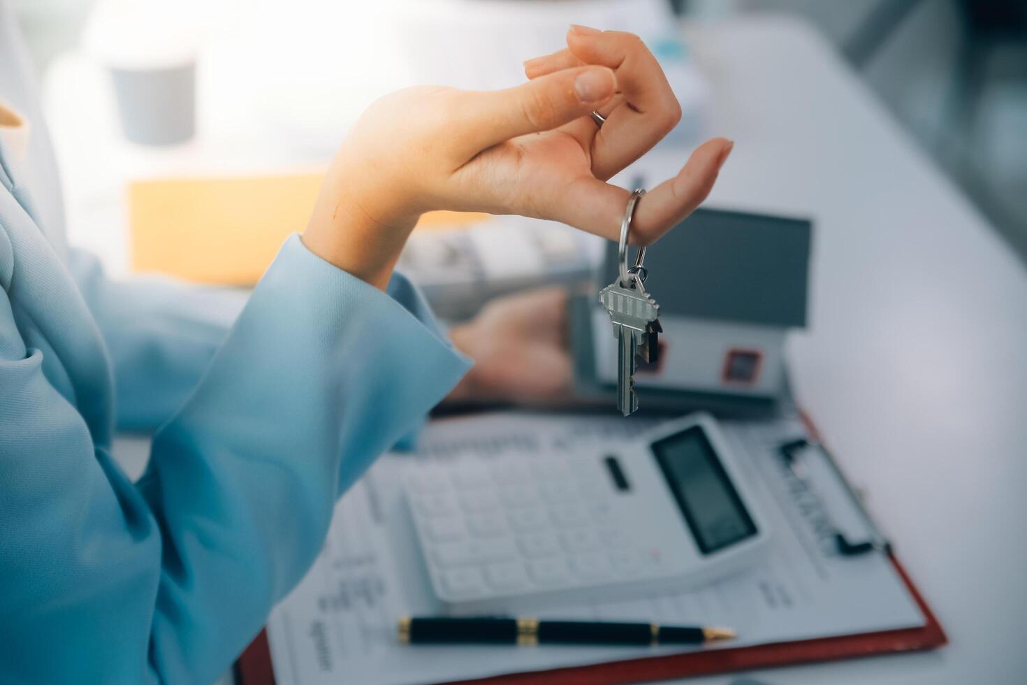 Real estate agent talked about the terms of the home purchase agreement and asked the customer to sign the documents to make the contract legally, Home sales and home insurance concept. photo