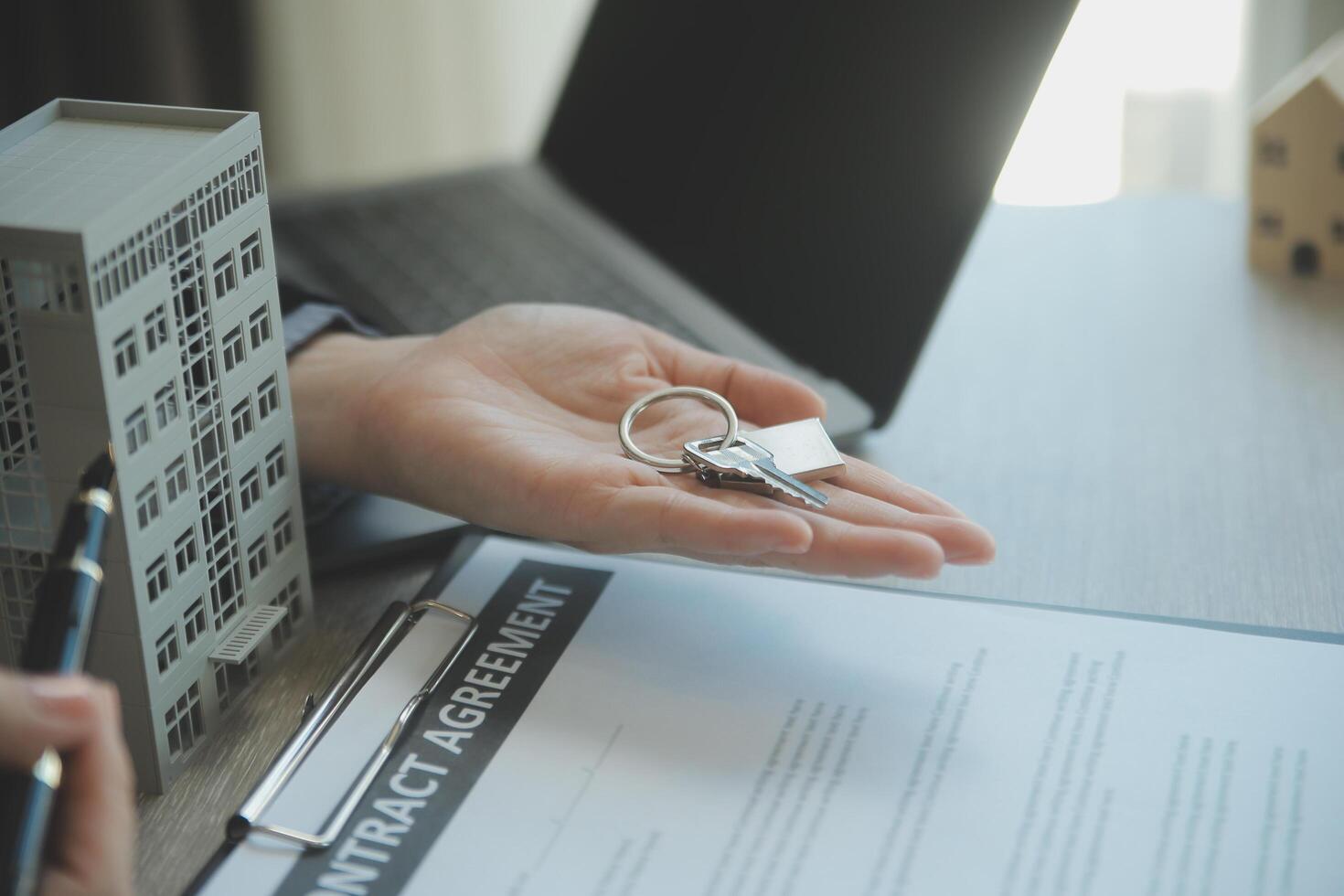Real estate agent and customer signing contract to buy house, insurance or loan real estate.rent a house,get insurance or loan real estate or property. photo