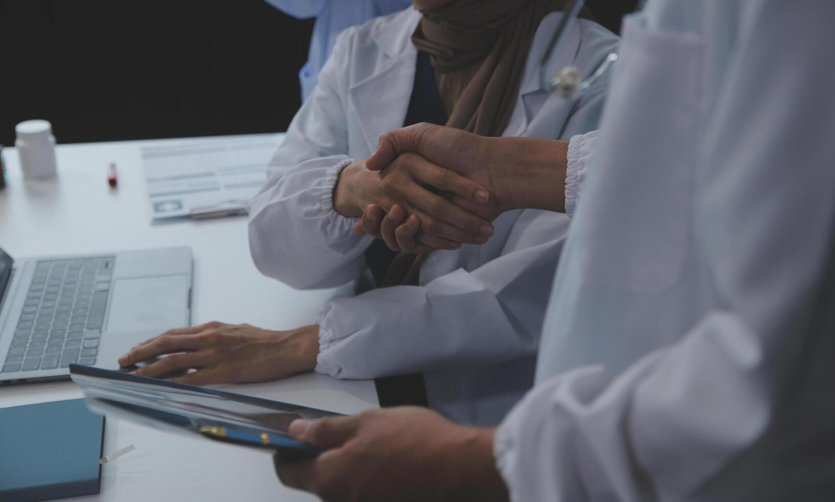 The medical team joins hands and works togetherGroup of scientists joining hands to create experimental works that meet their goals or the success of the trials that have been completed photo