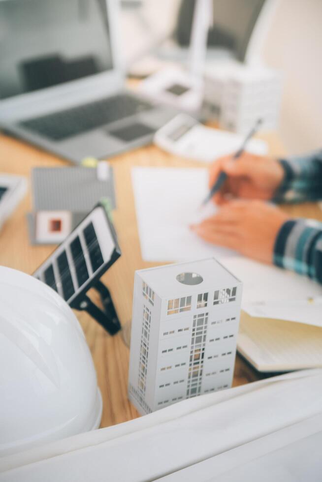Wind energy engineer designing and developing project for residential district photo