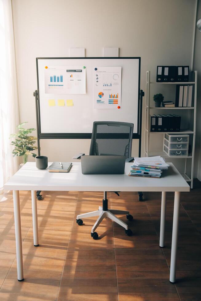 Office workplace with laptop and smart phone on wood table photo