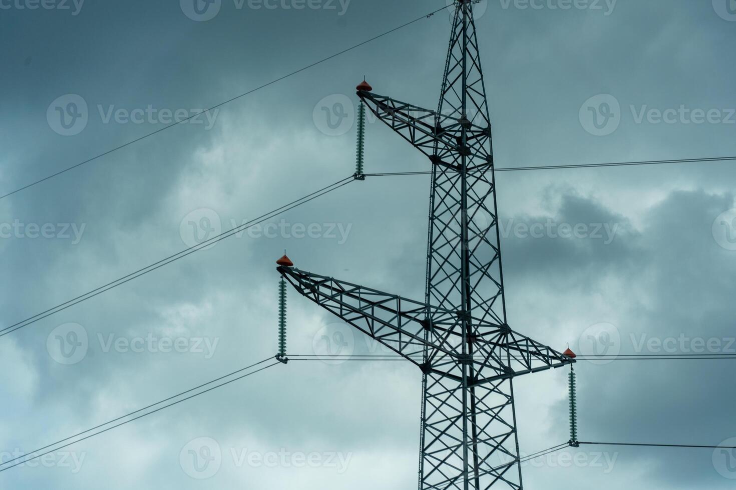 High voltage towers with sky background. Power line support with wires for electricity transmission. High voltage grid tower with wire cable at distribution station. Energy industry, energy saving photo