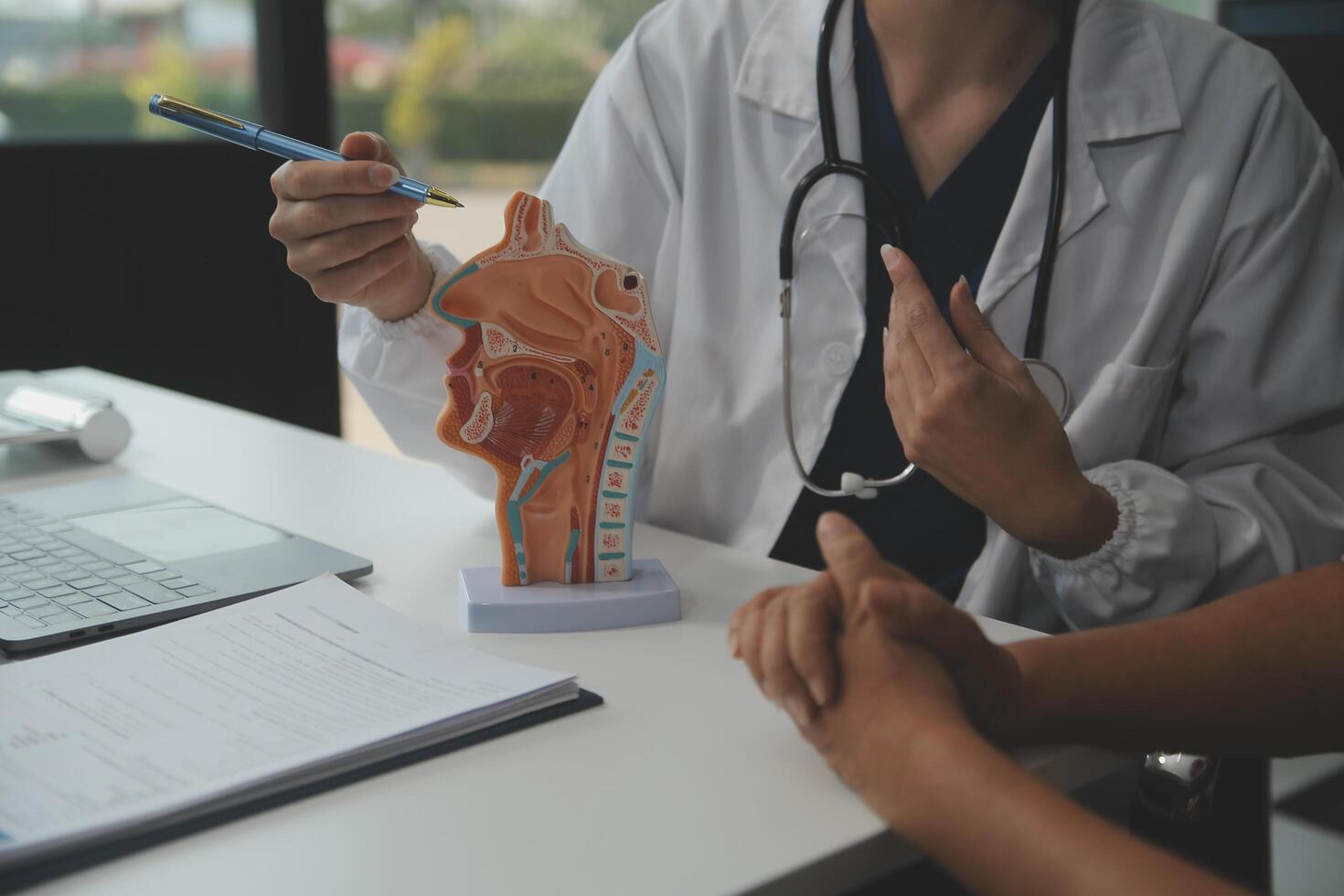Female doctor explaining to patient results of model the process of patients. Diagnosis of diseases for Model Internal organ. photo