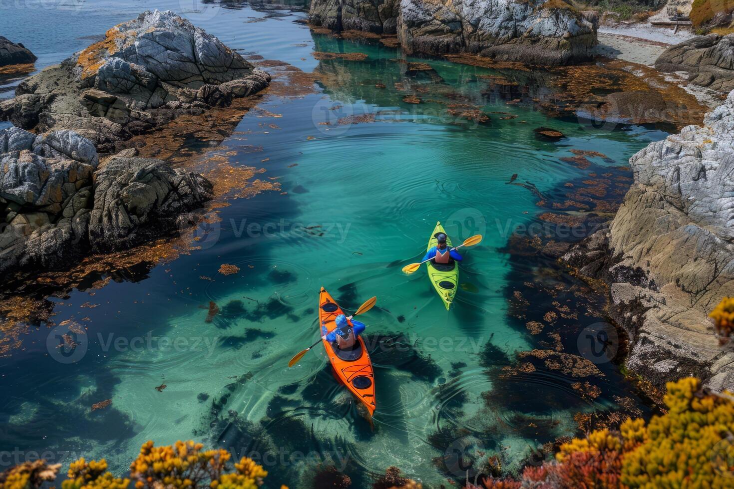 Pair of colorful kayaks resting on the shore, beckoning adventurers to explore hidden coves photo