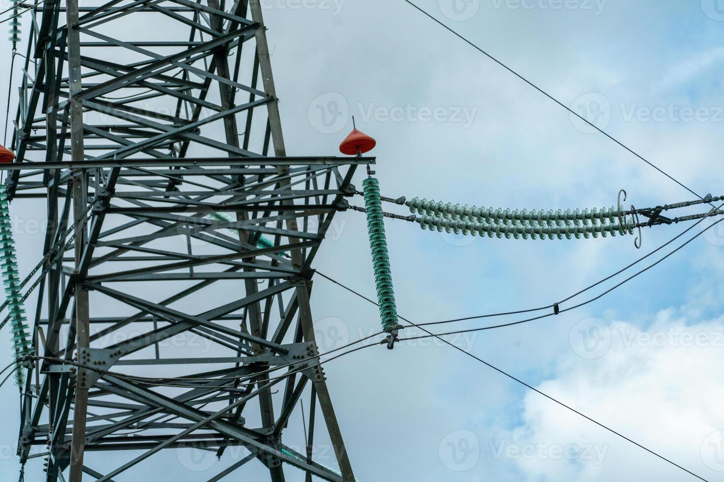 High voltage towers with sky background. Power line support with wires for electricity transmission. High voltage grid tower with wire cable at distribution station. Energy industry, energy saving photo
