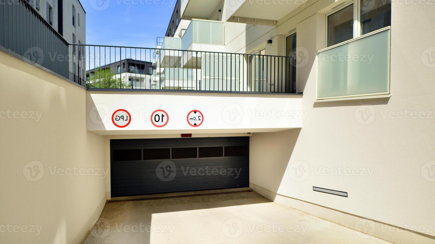 Contemporary residential building exterior in the daylight. Modern apartment buildings on a sunny day with a blue sky. Facade of a modern apartment building photo
