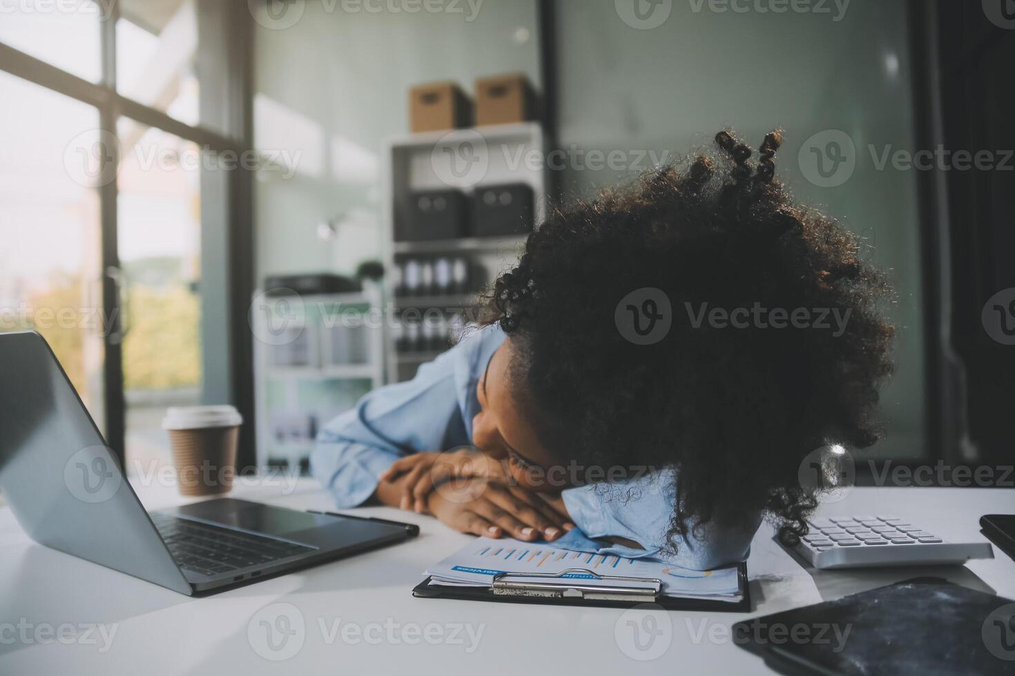 Sad tired young asian lady thinking, sleep at laptop, suffering from overwork, stress in room interior. Deadline, problems in study, work, business, freelance at home new normal with tech photo
