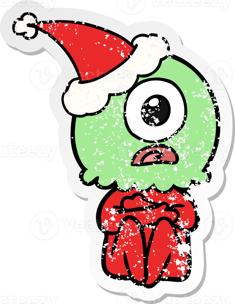 hand drawn distressed sticker cartoon of a cyclops alien spaceman wearing santa hat png