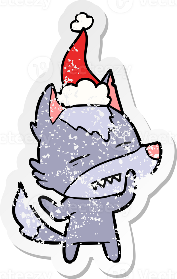 hand drawn distressed sticker cartoon of a wolf showing teeth wearing santa hat png