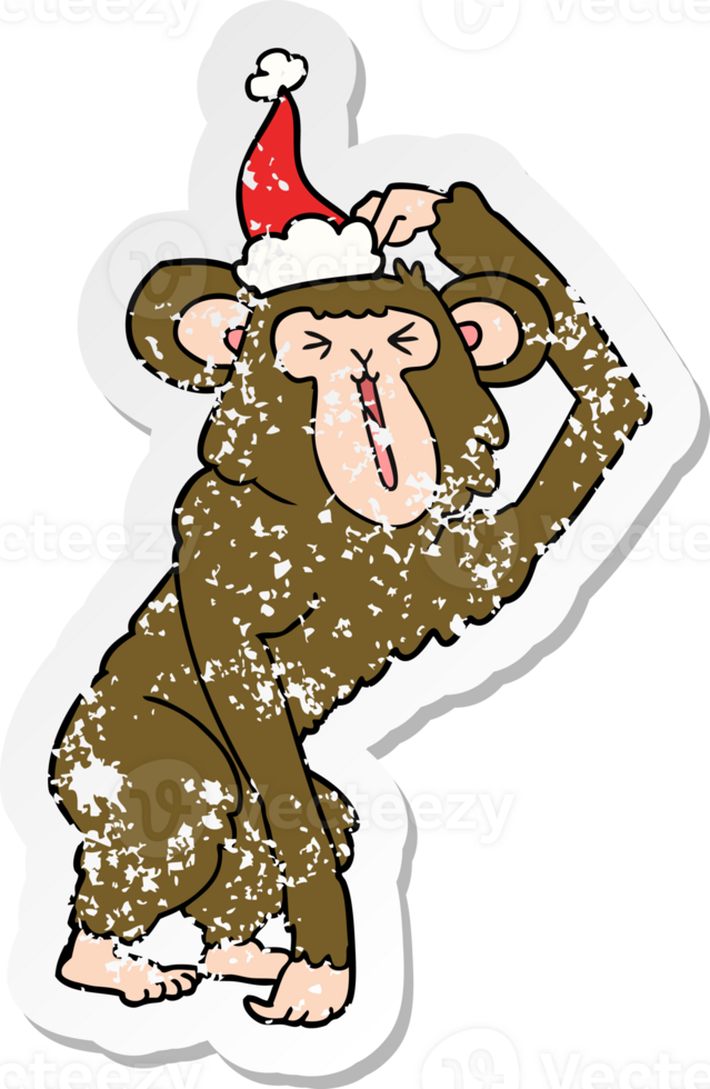 hand drawn distressed sticker cartoon of a chimp scratching head wearing santa hat png