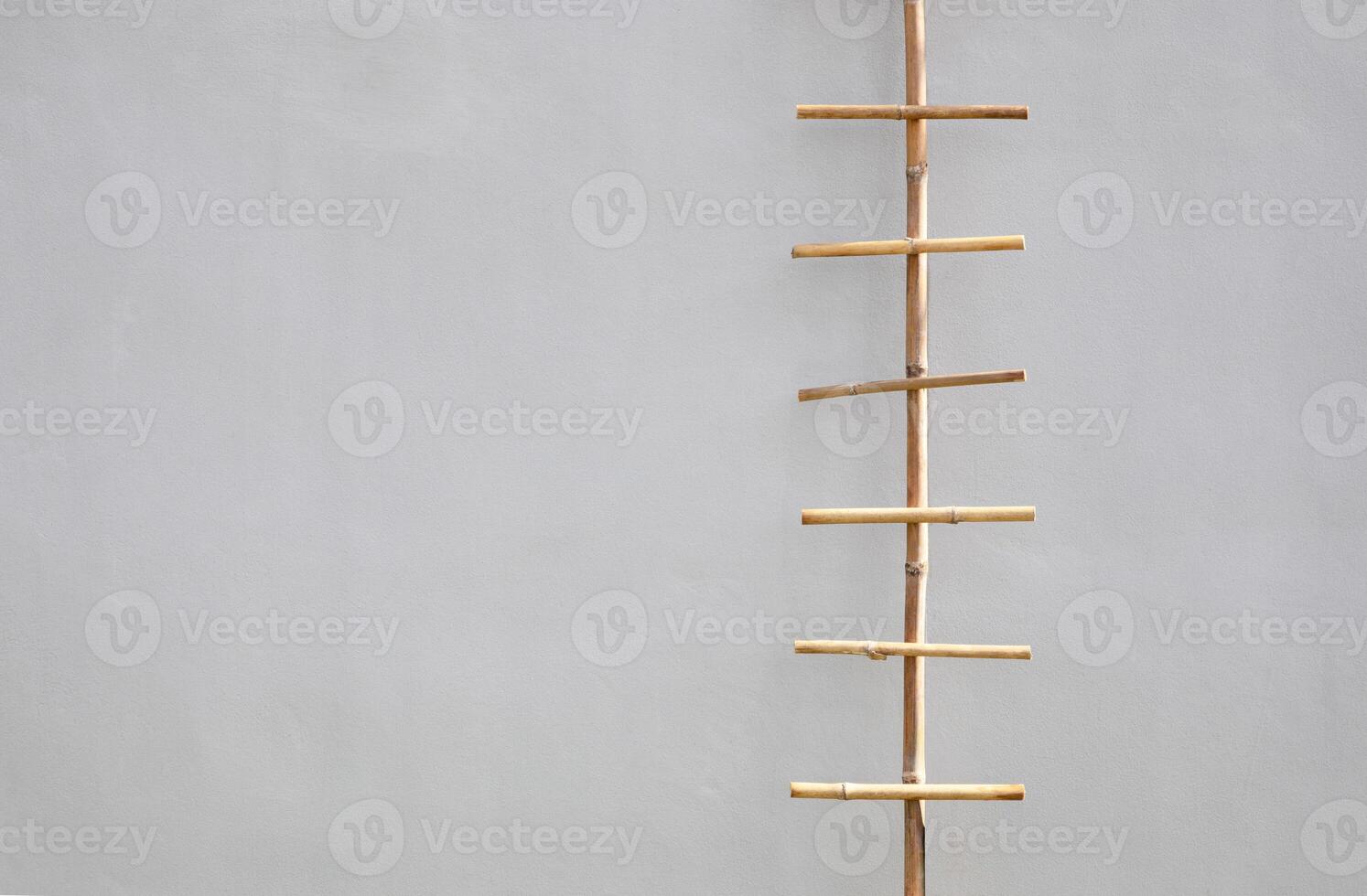 Bamboo sticks on cement wall. photo