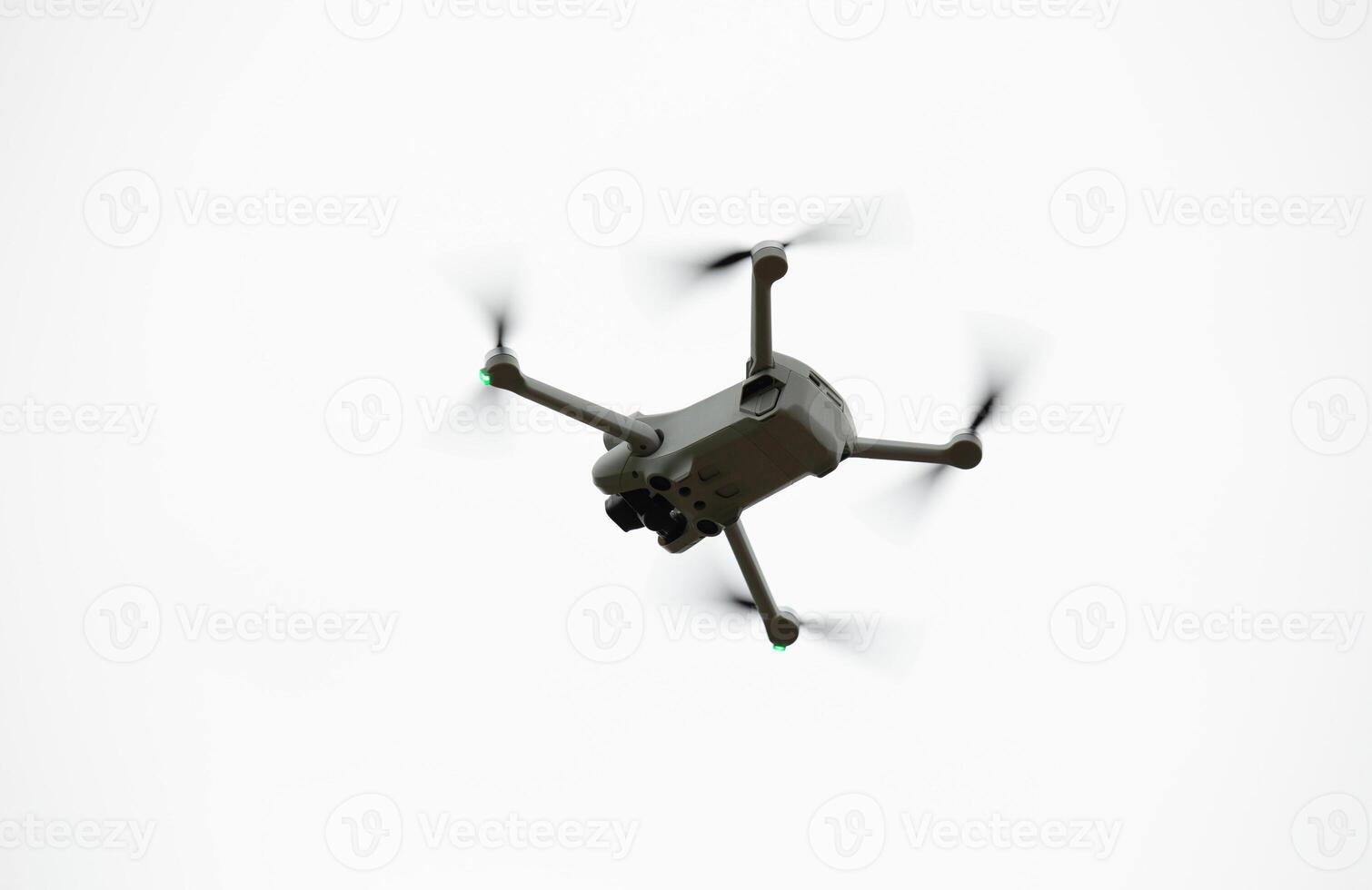 Flying drone quadcopter with a camera on white background. photo
