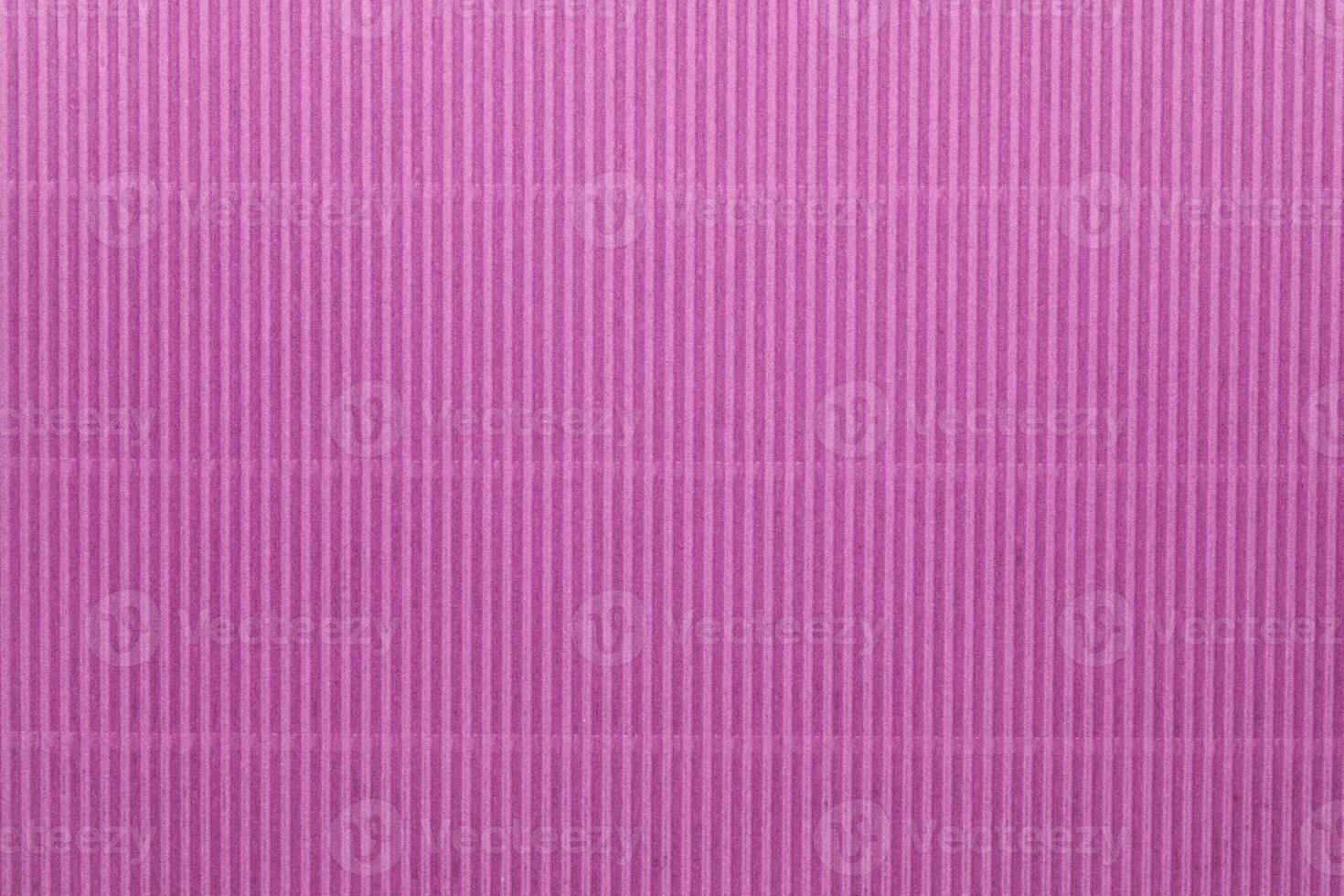 Pink corrugated paper texture or background photo