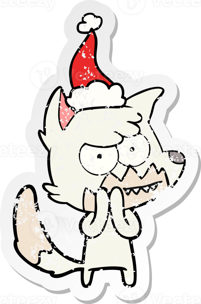 hand drawn distressed sticker cartoon of a grinning fox wearing santa hat png