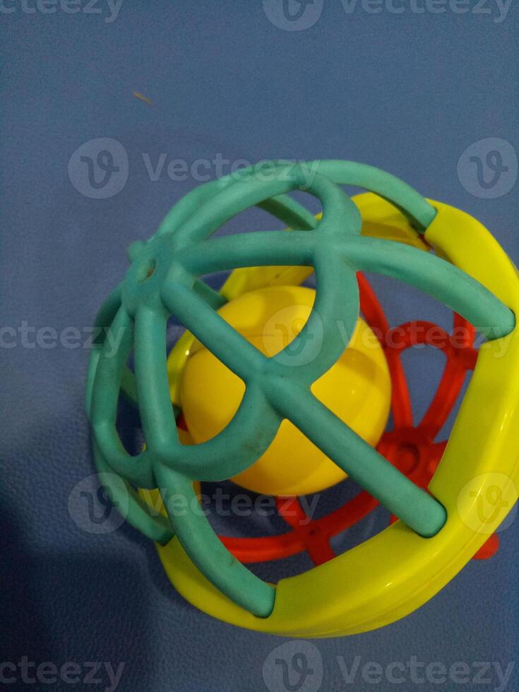 Ball toy with colorful plastic spokes with a loud sound for babies photo