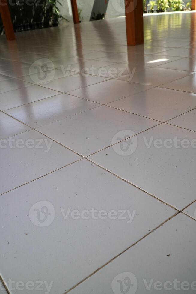 the floor of a building is made of clean white ceramic photo