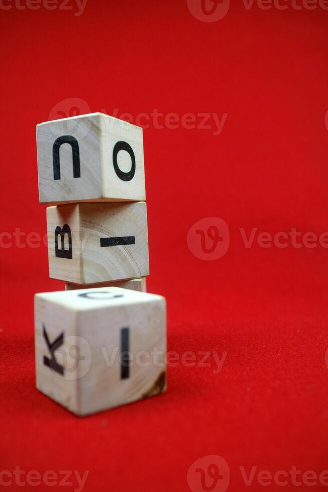 Educational stacking cube toy made of wood with numbers and letters photo
