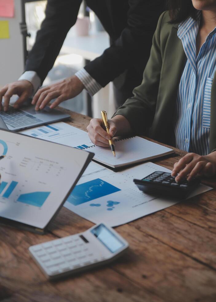 Co working conference, Business team meeting present, investor colleagues discussing new plan financial graph data on office table with laptop and digital tablet, Finance, accounting, investment. photo