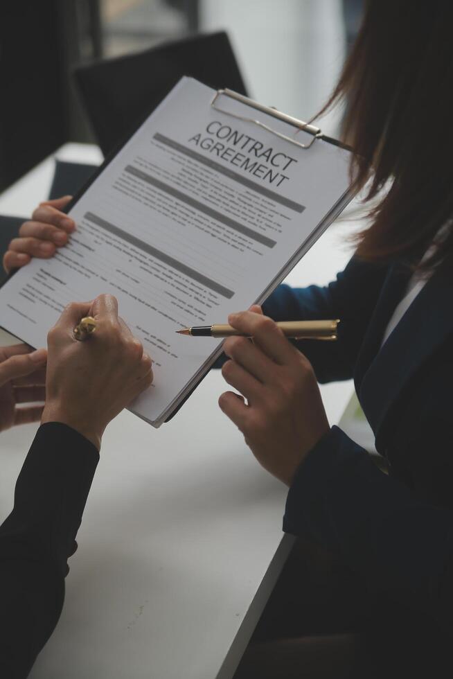 Business Signing a Contract Buy - sell house, insurance agent analyzing about home investment loan Real Estate concept. photo