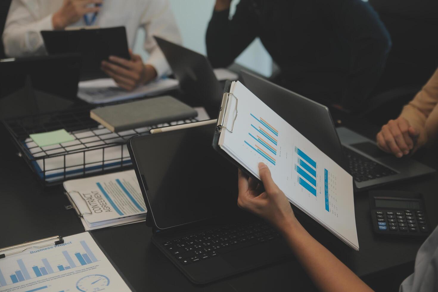 Business team collaboration discussing working analyzing with financial data and marketing growth report graph in team, presentation and brainstorming to strategy planning making profit of company. photo
