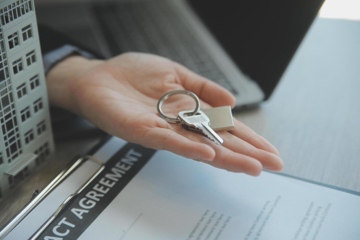 Real estate agent and customer signing contract to buy house, insurance or loan real estate.rent a house,get insurance or loan real estate or property. photo