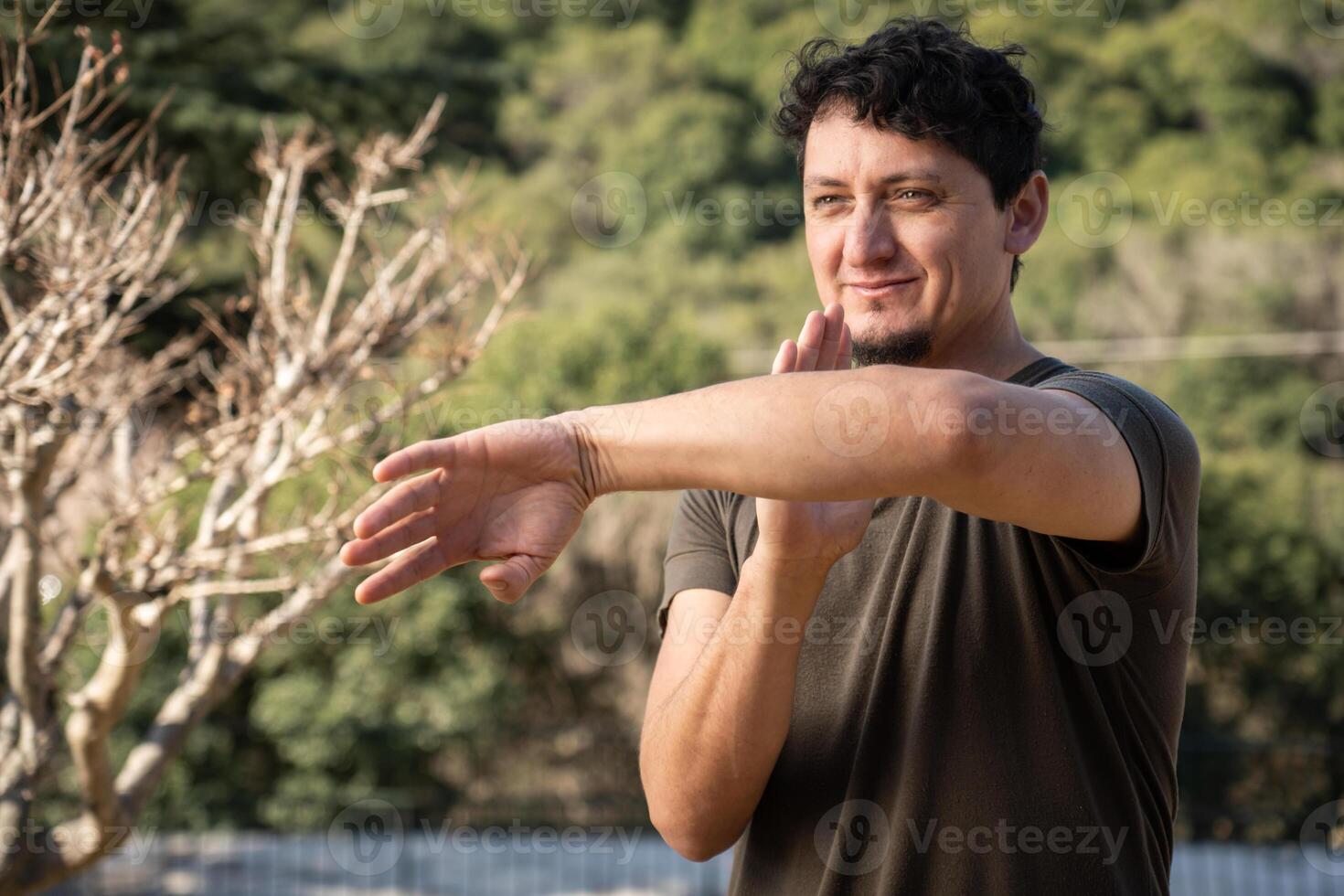 Man Practices Martial Arts in Nature. Copy space. photo
