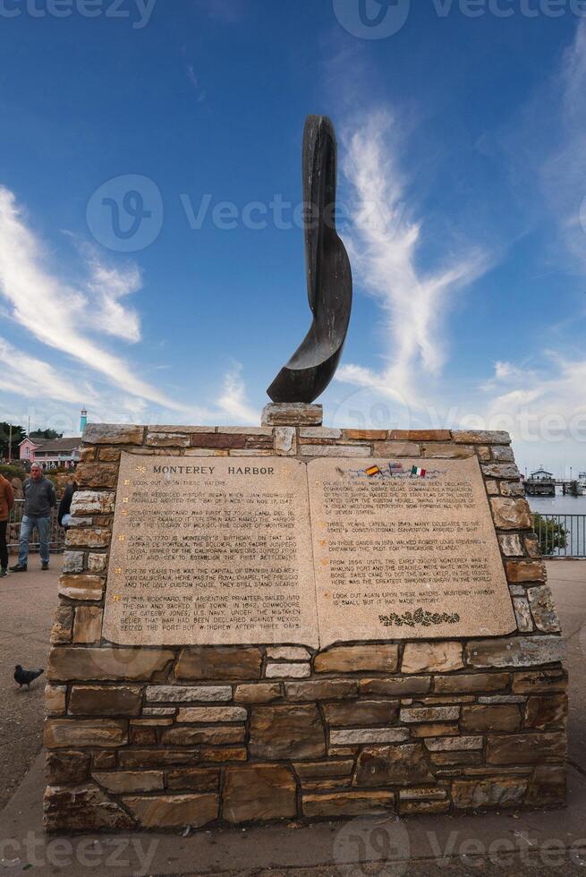 Monterey Harbor Monument with Open Book Design and Feather like Object, California photo