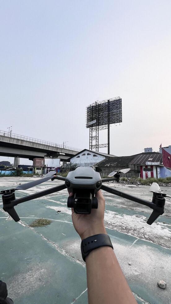 Close-up of hand holding drone. Bekasi, Indonesia, April 22, 2024 photo