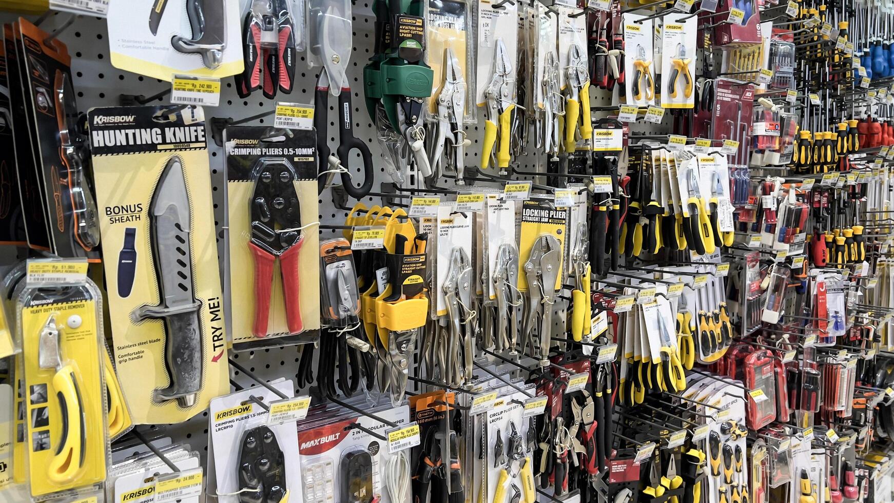 shelf with power tools in the store Ace hardware. Necessary tools for small repairs in everyday life. Bekasi, Indonesia, May 1, 2024 photo