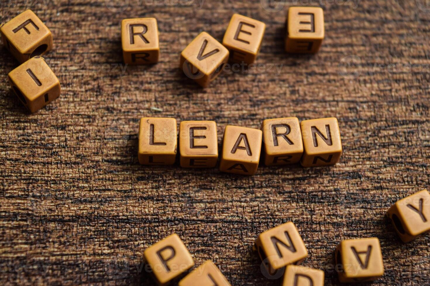 Concept of Learn message written on wooden blocks. Cross processed image on Wooden Background photo