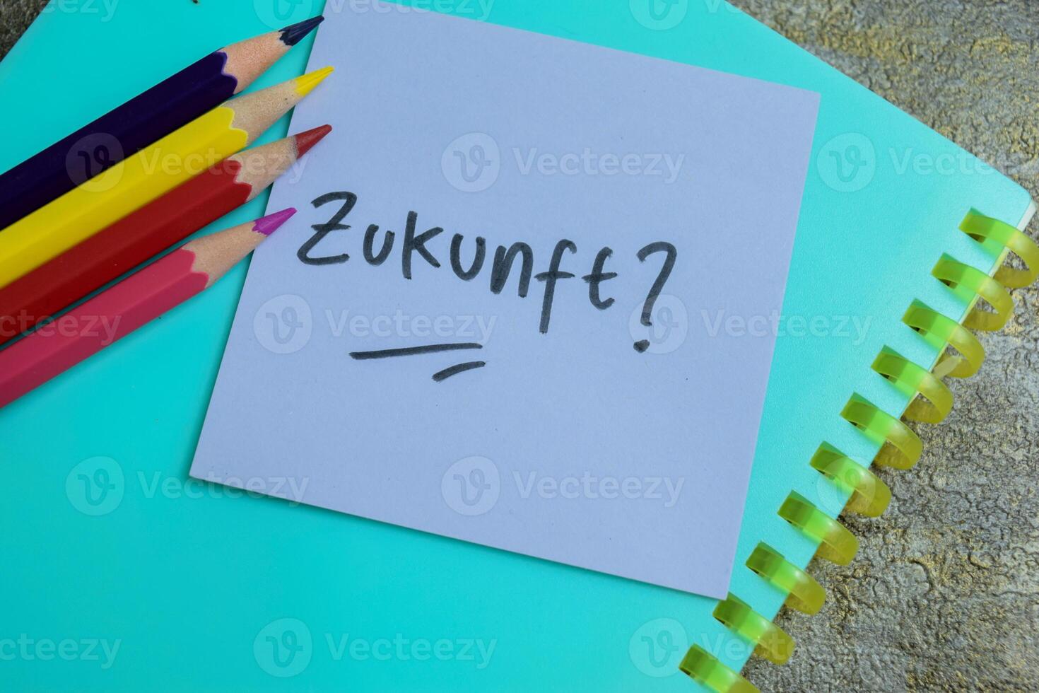 Concept of Learning language - German. Zukunft it means Future written on sticky notes. German language isolated on Wooden Table. photo