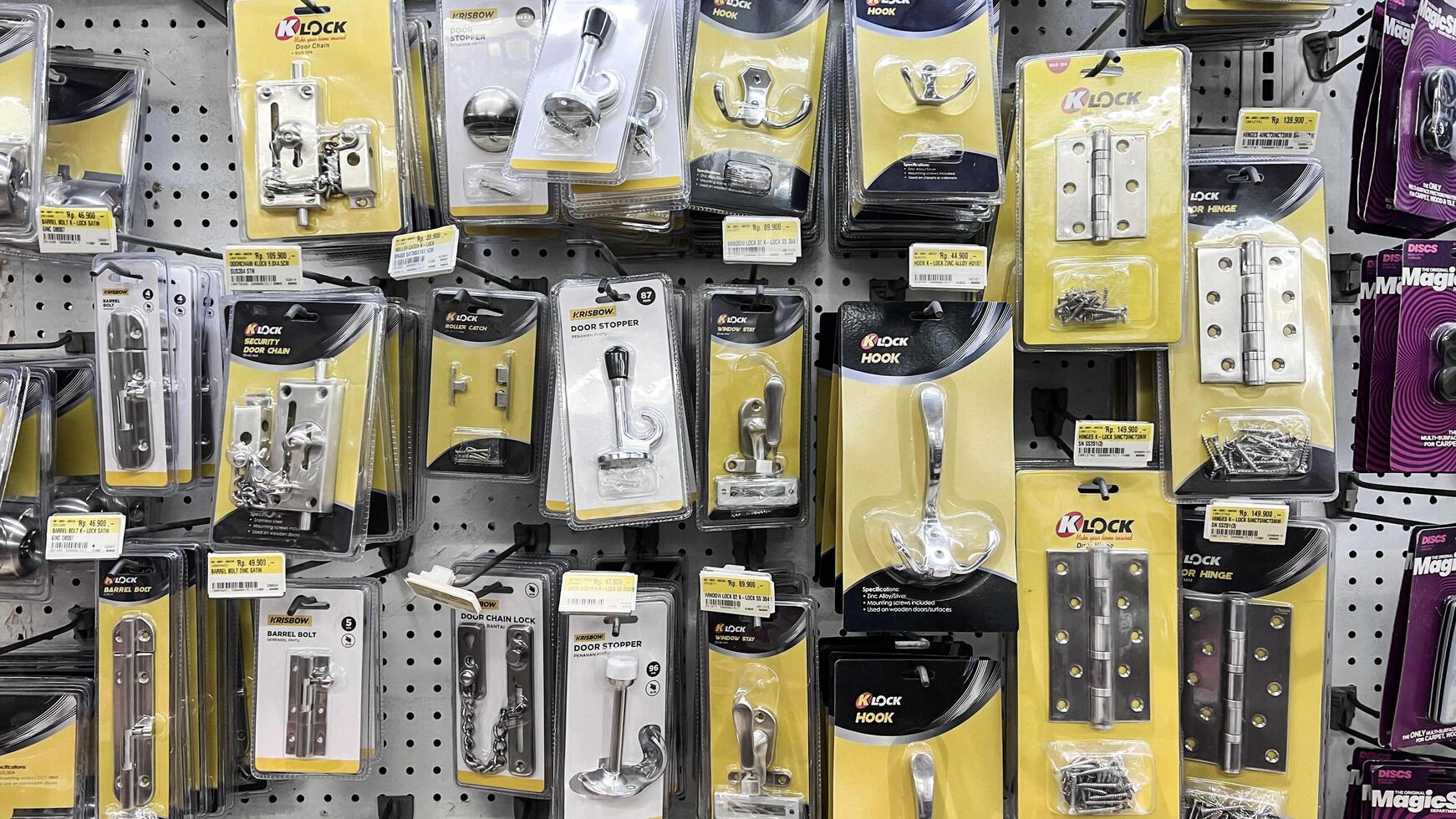 shelf with power tools in the store Ace hardware. Necessary tools for small repairs in everyday life. Bekasi, Indonesia, May 1, 2024 photo