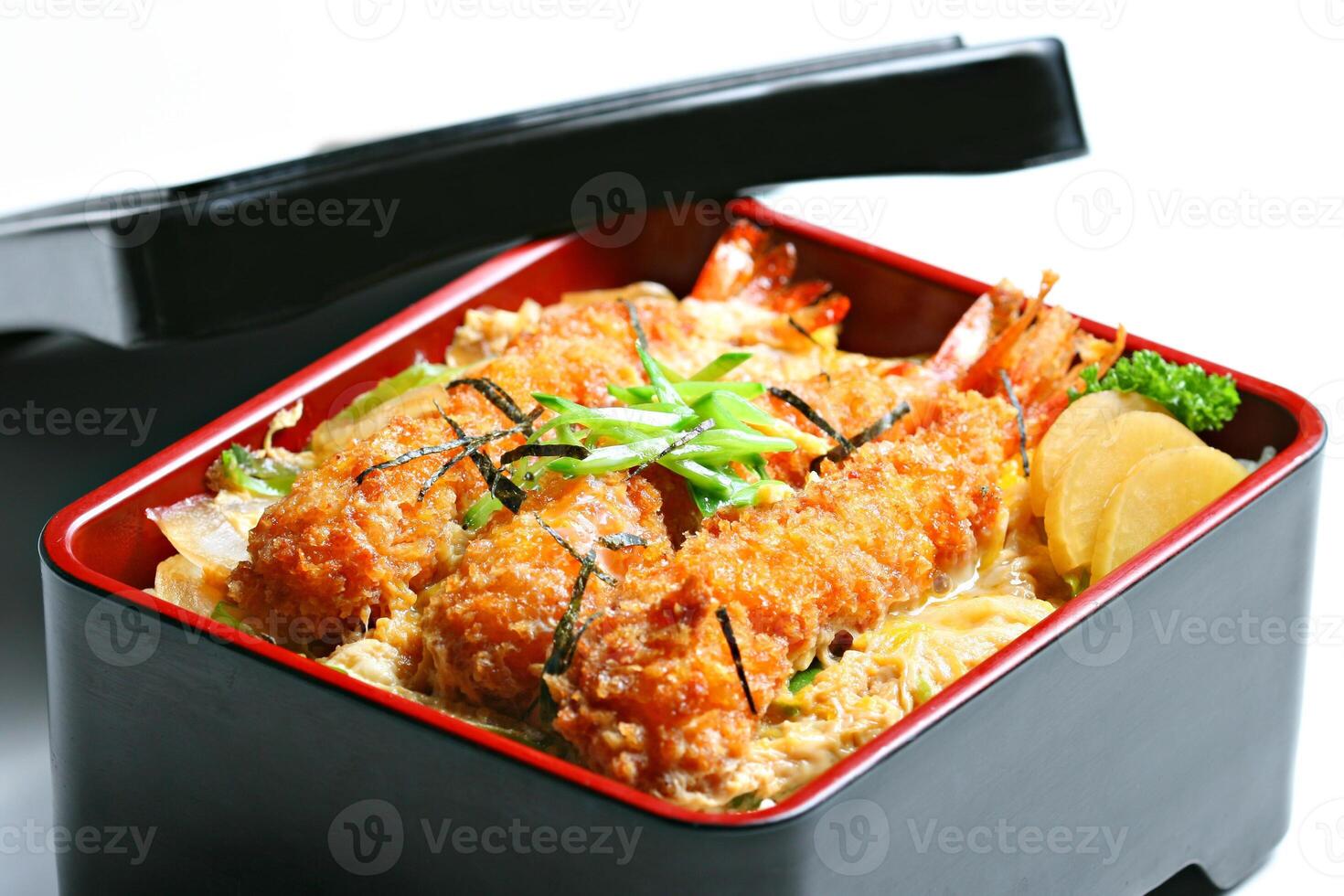 Ebi tempura don or Ebi Kakiage served with red pickled vegetables or Fukujin Zuke in white background photo