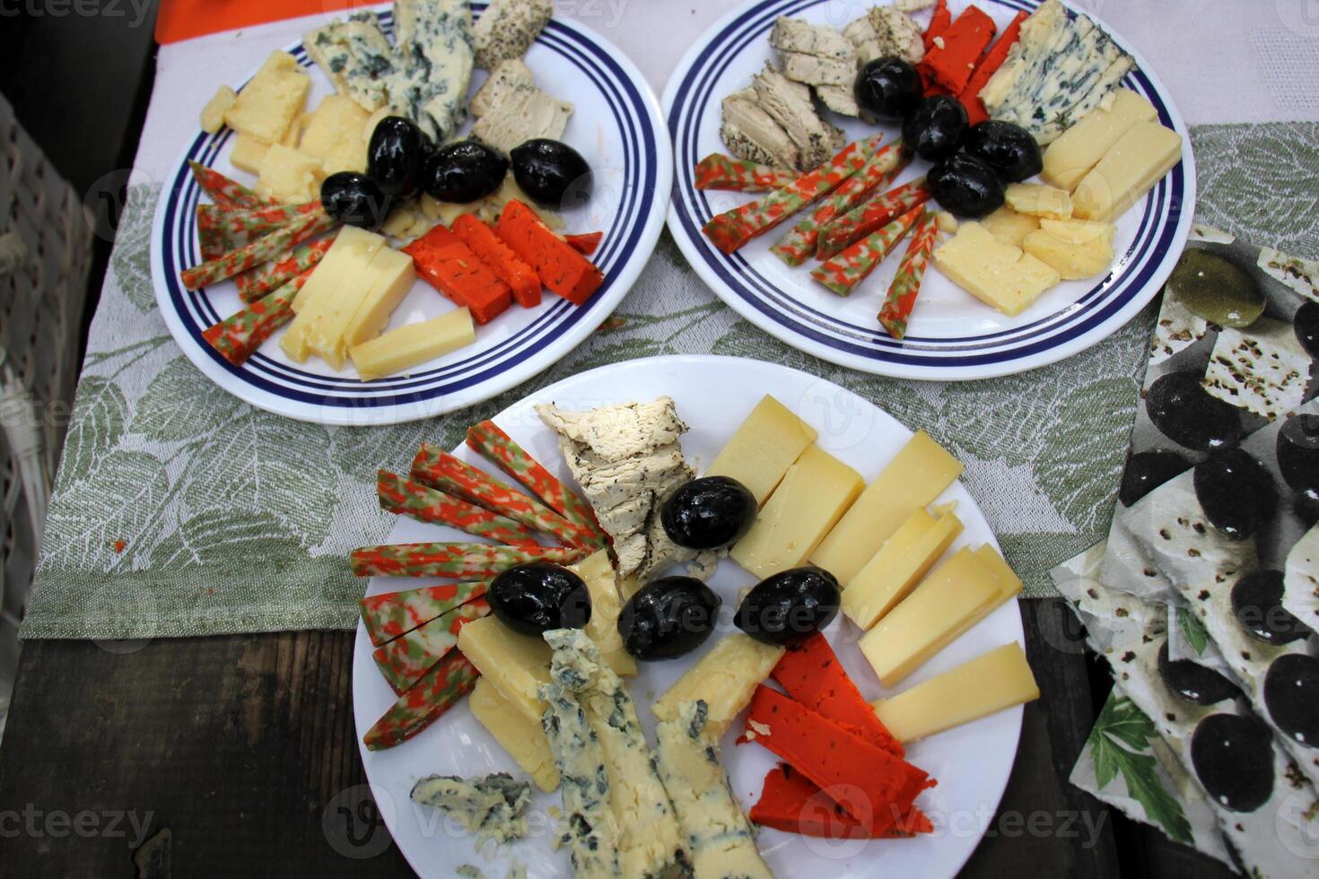 Table in a restaurant with a variety of snacks and food. photo