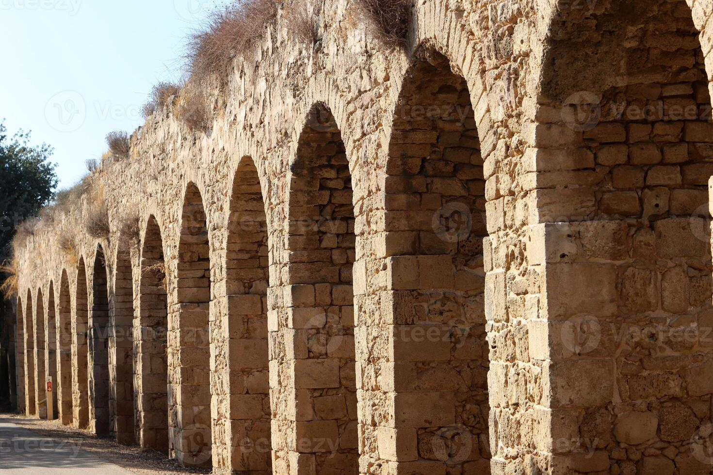 An ancient aqueduct for supplying water to populated areas. photo