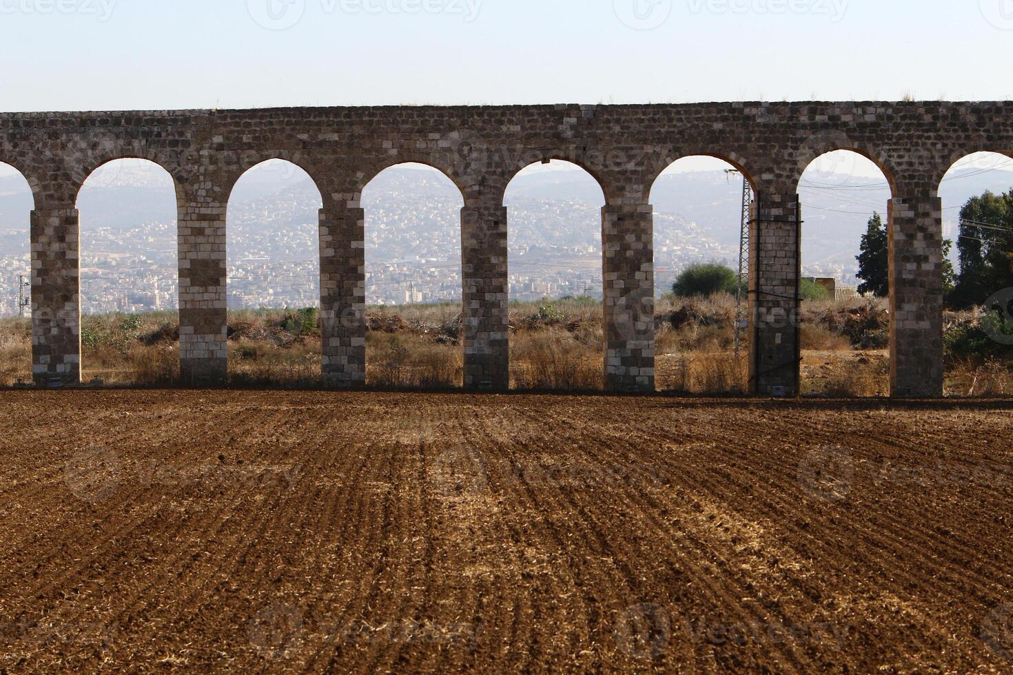 An ancient aqueduct for supplying water to populated areas. photo
