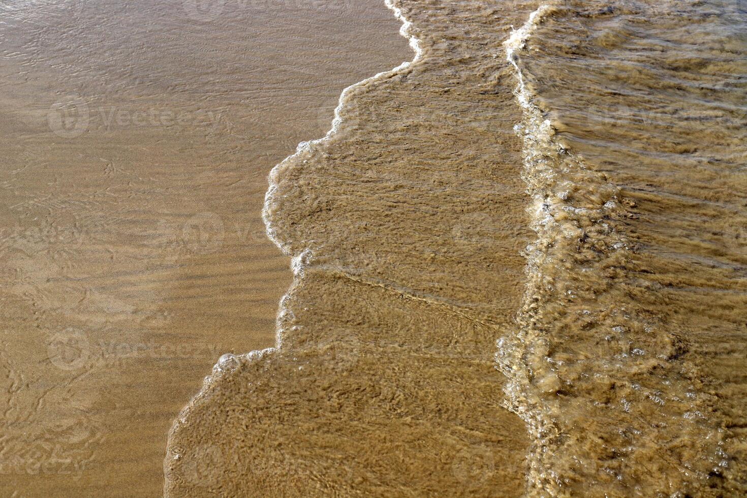The color of water in the Mediterranean Sea in shallow water. Natural abstract background. photo
