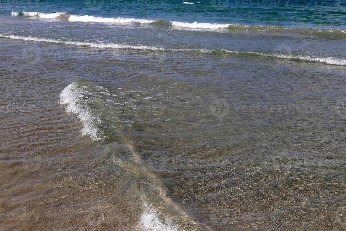 The color of water in the Mediterranean Sea in shallow water. Natural abstract background. photo