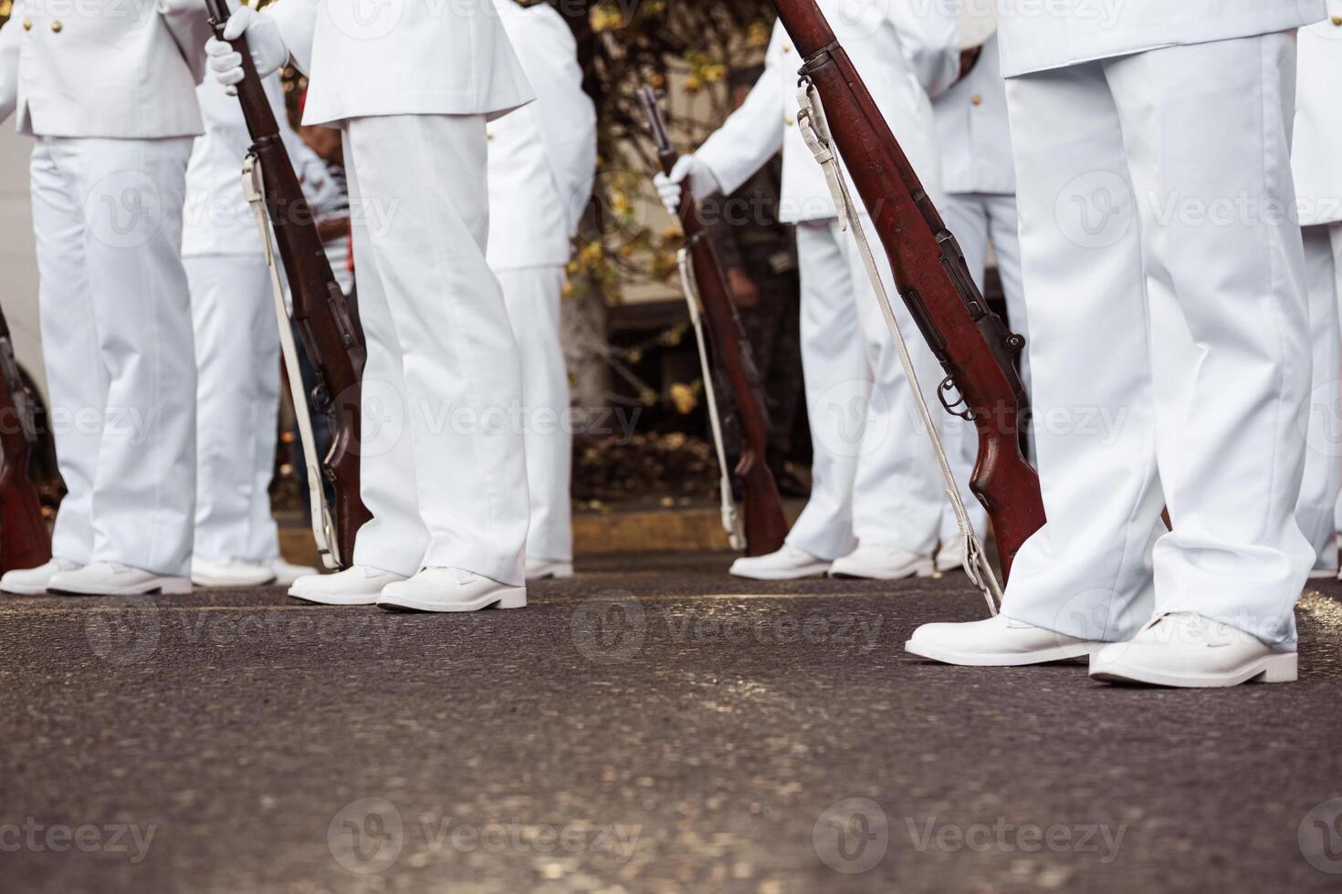 Group of navy force wearing white boot holding a rifle war's. Independence and protection concept. photo
