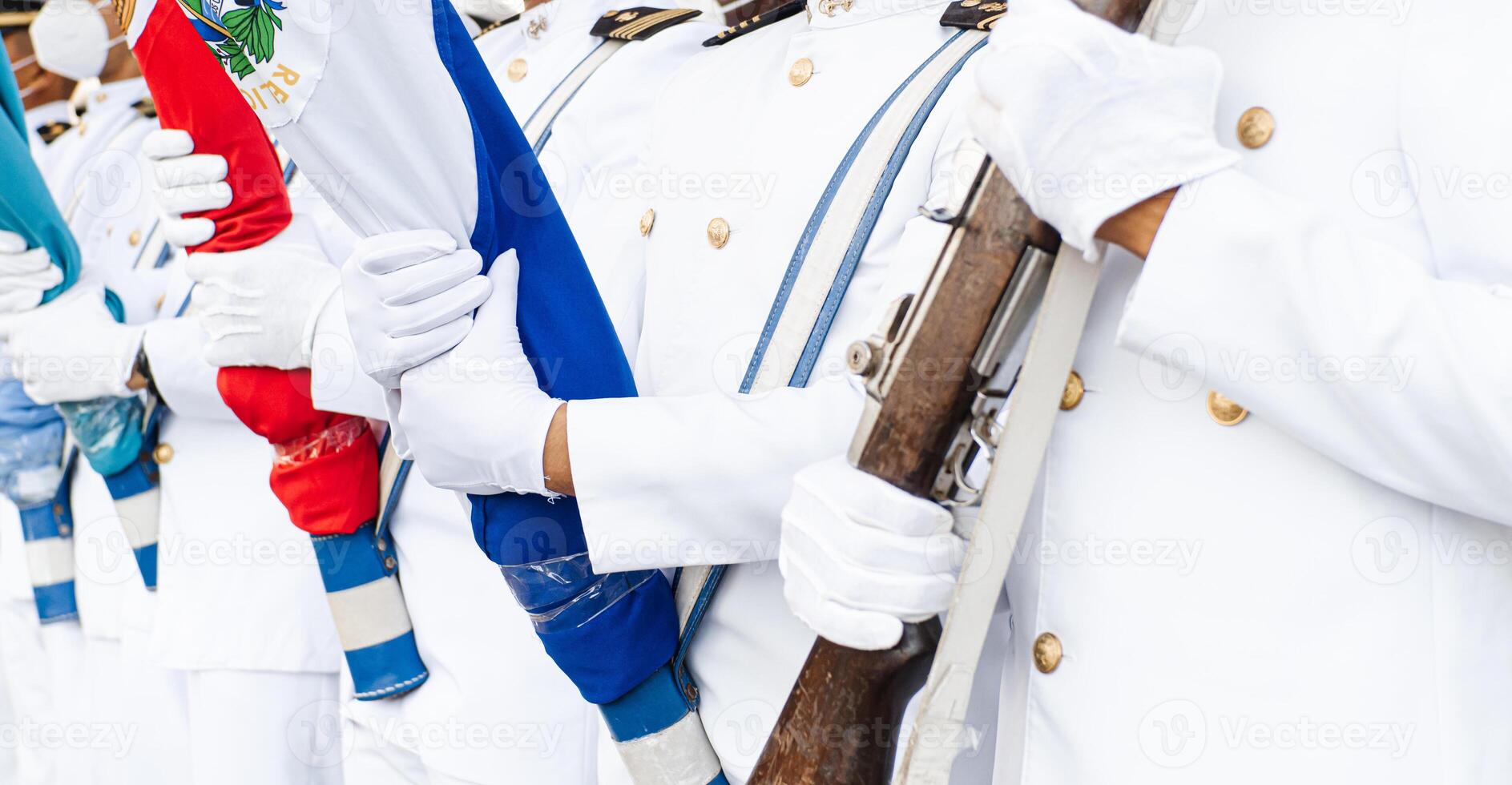 group of hands with gloves holding flags. photo
